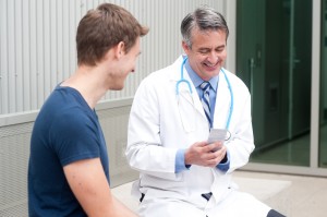 mature doctor with patient